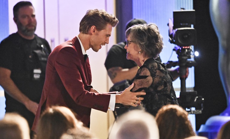 Austin Butler helps Sally Field at the 29th Annual Screen Actors Guild Awards.