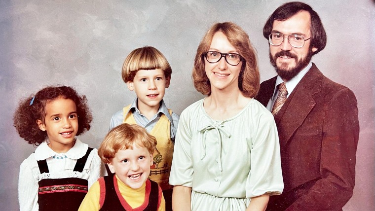 The author (far left) as a girl with her adoptive family.