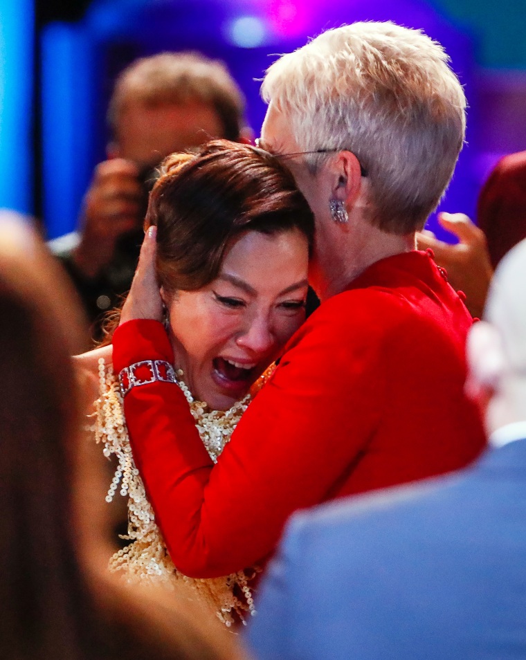 Michelle Yeoh embraces Jamie Lee Curtis as she accepts the award for Female Actor in a Leading Role at the 29th Annual SAG Awards