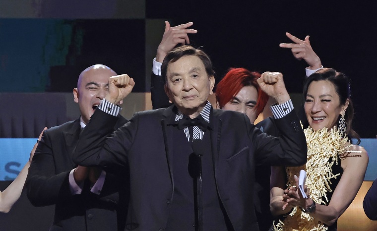 Brian Le, James Hong, Andy Le, and Michelle Yeoh accept the Outstanding Performance by a Cast in a Motion Picture award for "Everything Everywhere All at Once."