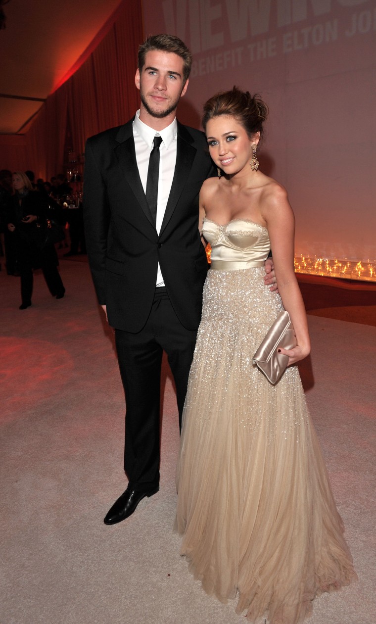 Liam Hemsworth and singer Miley Cyrus attend the 18th Annual Elton John AIDS Foundation Oscar party held at Pacific Design Center on March 7, 2010 in West Hollywood, California.  