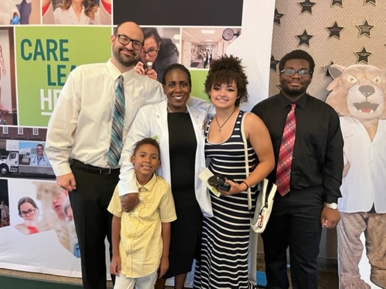 Shamone Gore Panter, center, is pictured with her family. She says going to medical school in her 40s is setting an example for her children that it is never too late for them to follow their dreams.