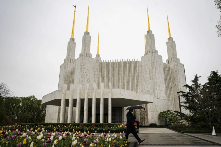 A person walks past the Washington D.C. Temple of the Church of Jesus Christ of Latter-day Saints in Kensington, Md., in August.