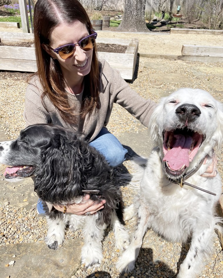 Emily Walthall, now 40, shares a happy moment with her dogs.