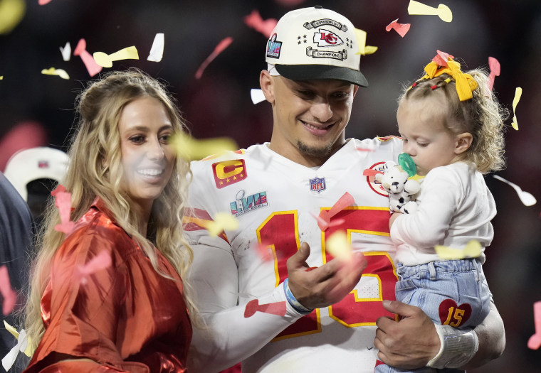 Kansas City Chiefs quarterback Patrick Mahomes (15) and his wife Brittany, left, celebrate with their daughter, Sterling Skye Mahomes
