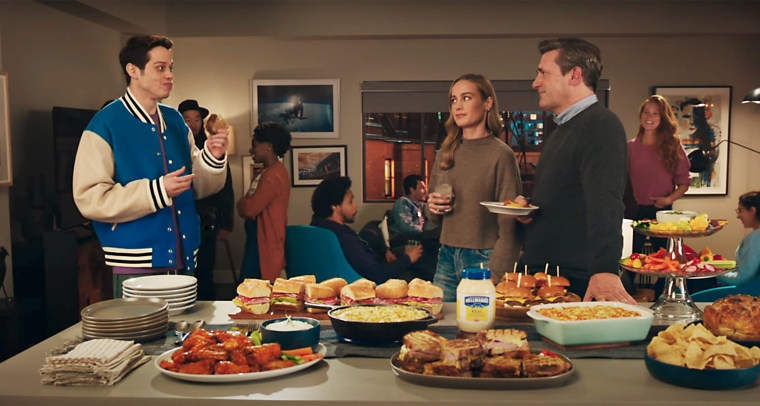 Pete Davidson eats a (Jon) Hamm and Brie (Larson) sandwich in Hellmann’s Super Bowl ad