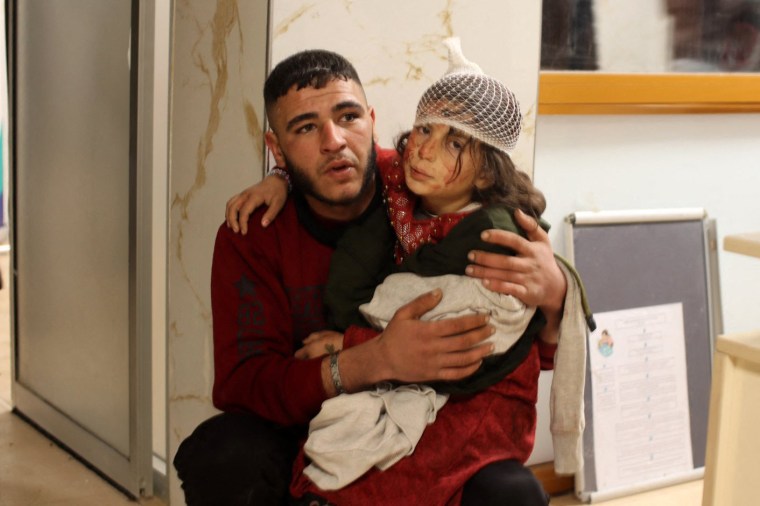 A young girl awaits treatment at a hospital in the border town of Azaz in the rebel-held north of Syria's Aleppo province. 