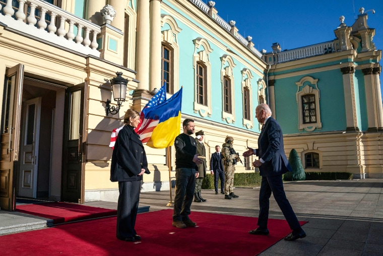 Image: President Joe Biden is greeted by Ukrainian President Volodymyr Zelensky and his wife Olena, as he arrives at the Mariinsky Palace in Kyiv on Feb. 20, 2023.