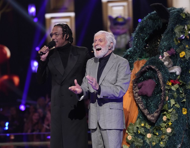 Host Nick Cannon and Dick Van Dyke in the season nine premiere of The Masked Singer. 