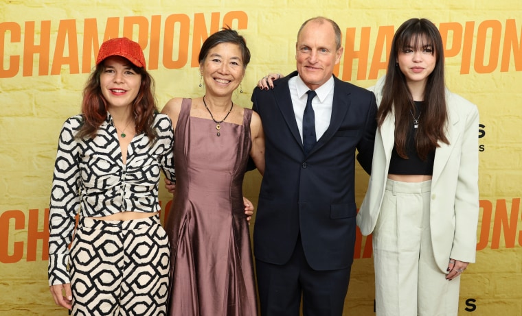Laura Louie and Woody Harrelson (middle) at the premiere of "Champions" with their two daughters on February 27, 2023 in NYC.