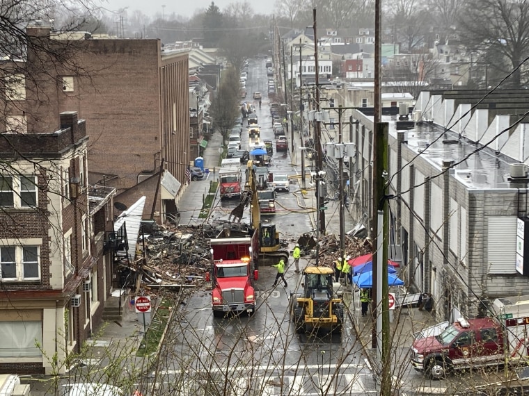 Emergency responders and heavy equipment are seen at the site of a deadly explosion at a chocolate factory Saturday  in West Reading, Pennsylvania.