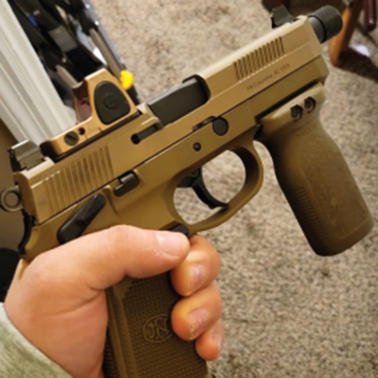 A handgun alleged to have been modified by Thomas Develin, which would be subject to additional federal rules, in a photo included in a criminal complaint.
