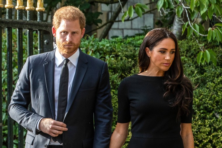 Prince Harry and Meghan, the Duke and Duchess of Sussex, arrive to view floral tributes to Queen Elizabeth II laid outside Cambridge Gate at Windsor Castle on Sept. 10, 2022 in Windsor, U.K.