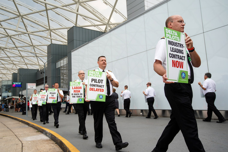 Delta Air Lines pilots during a nationwide protest against the union contract at Atlanta Hartsfield-Jackson International Airport on June 30, 2022.