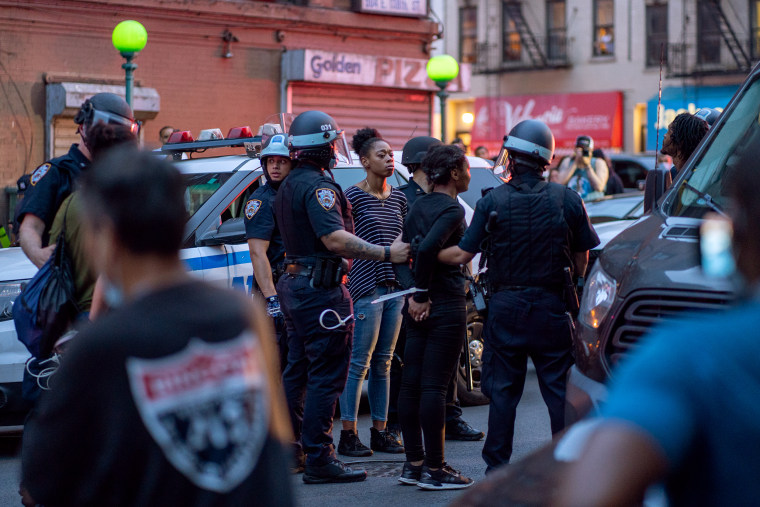 NYPD officers arrest protesters for breaking the citywide 8:00PM curfew in Bronx, N.Y.