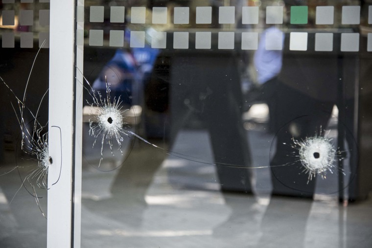 Bullet holes in the window of a supermarket belonging to the family of Antonela Roccuzzo, the wife of Argentine football star Lionel Messi, after attackers fired shots at the facade of the closed premises early in the morning in Rosario, Santa Fe Province, Argentina, on March 2, 2023. 