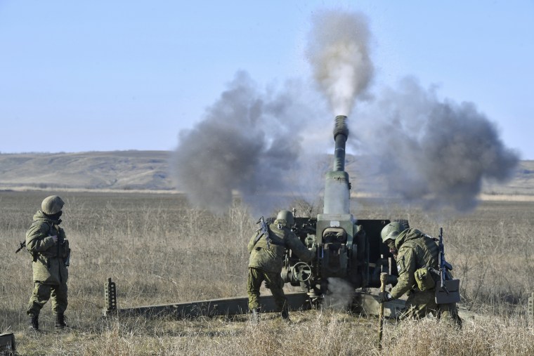 A Russian artillery unit fires a D-30 howitzer toward Ukrainian positions on Jan. 26, 2023.