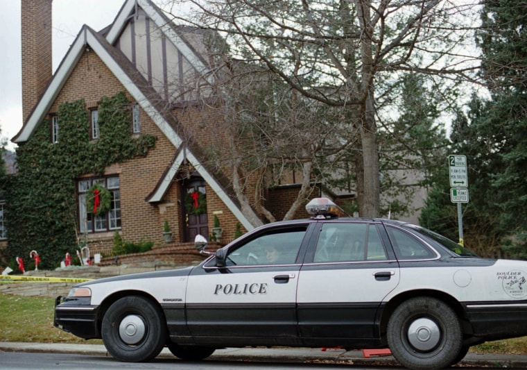 Police parked outside the home where JonBenet Ramsey was found murdered in Boulder, Colo., on Dec. 26, 1996. 