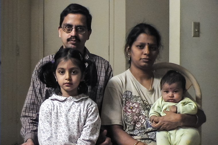 Sruti Suryanarayana as a child with their parents and sibling.