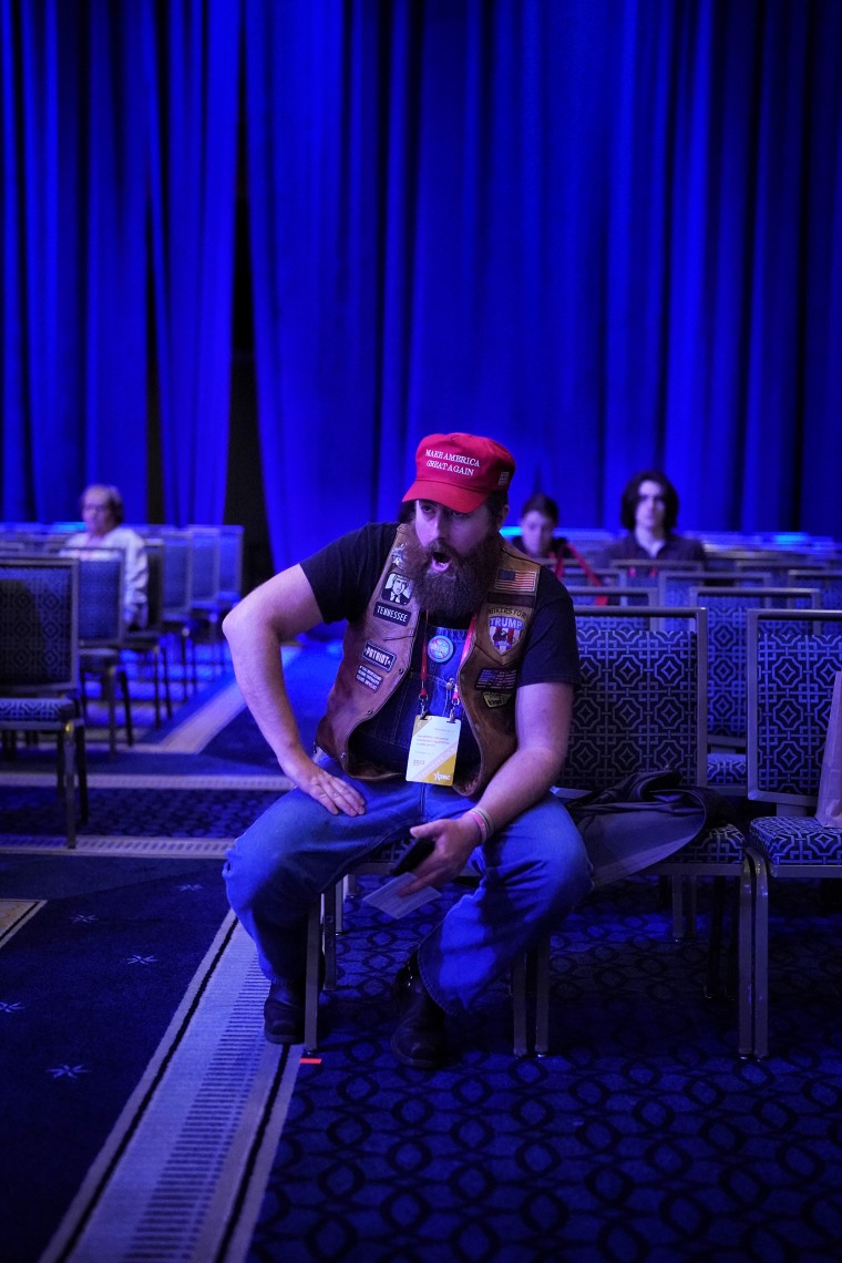 An attendee cheers during Rep. Marjorie Taylor Greene's speech at the CPAC in Fort Washington, Md.