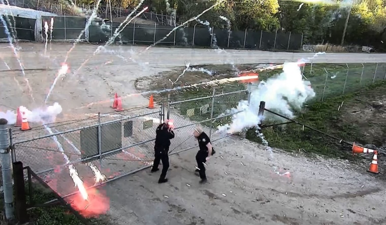 Protesters throw bricks at the site of police training center under construction in Atlanta on March 5, 2023.