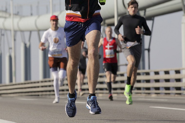 Runners make their way across the Verrazano-Narrows Bridge during the start of the New York City Marathon in 2019.
