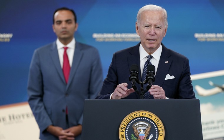 President Joe Biden, accompanied by Rohit Chopra, announces his administration's plans to eliminate junk fees for consumers, at the White House.