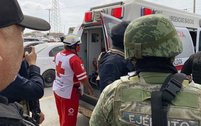 A Red Cross worker closes the door of an ambulance carrying two Americans found alive after their abduction in Mexico last week, on Tuesday, March 7, 2023, in Matamoros, Mexico.