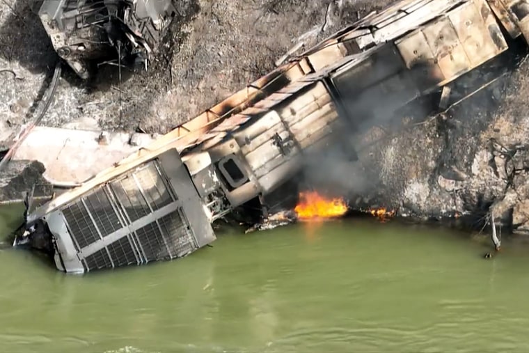 A damaged empty coal train is on fire after derailing in West Virginia on Wednesday morning.