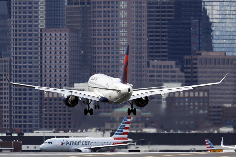 A plane lands at Logan International Airport
