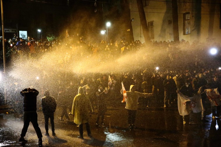Georgian police fired water cannon and tear gas at thousands of protesters Wednesday, ordering them to disperse as they rallied against a planned "foreign agent" law reminiscent of Russian legislation used to silence critics.