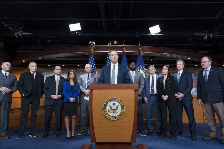 Rep. Scott Perry, R-Pa., center, and members of the House Freedom Caucus announcing their debt limit proposal Friday. 