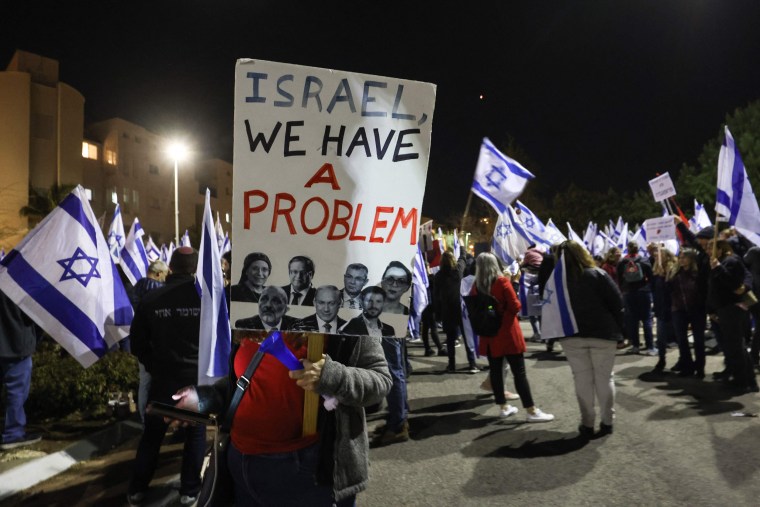 Israelis protest against the government's controversial judicial reform bill, in front of the residence of Justice Minister Yariv Levin, in Modiin