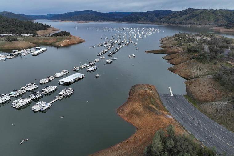 Houseboats sit anchored on Lake Oroville at Bidwell Canyon Marina on February 14, 2023 in Oroville, Calif.