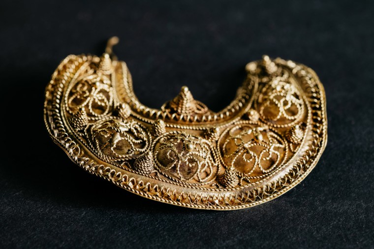 Detail of gold earring with filigree decoration,