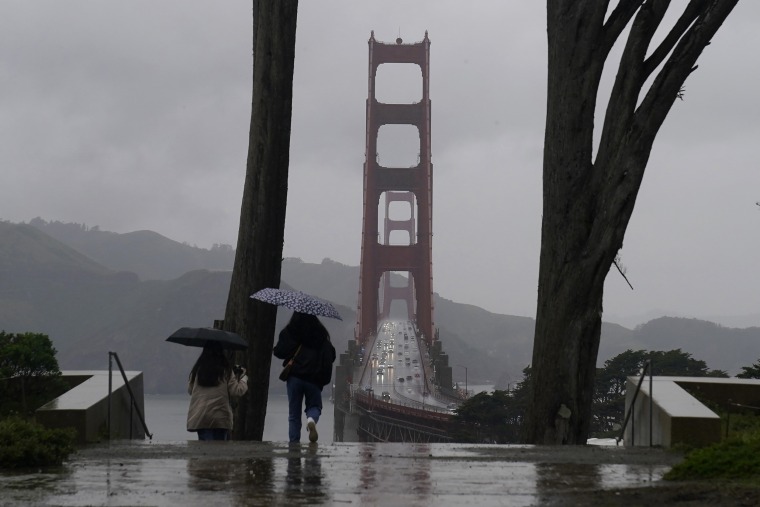 People walk along the path at the Golden Gate in San Francisco.