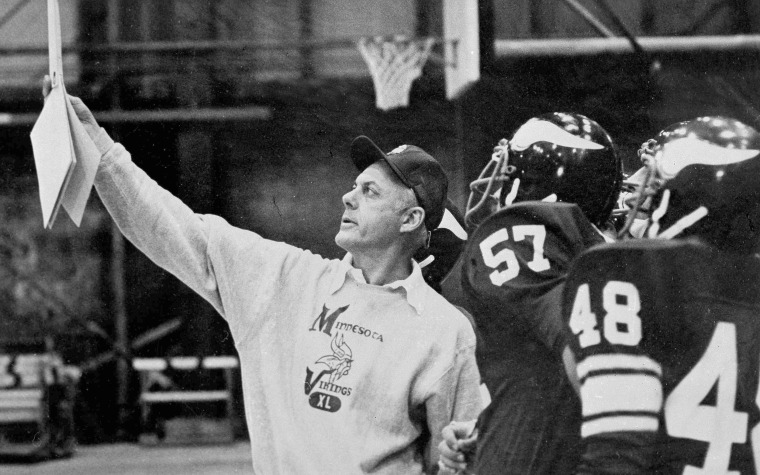 Minnesota Vikings coach bud Grant holds up chart during a practice 