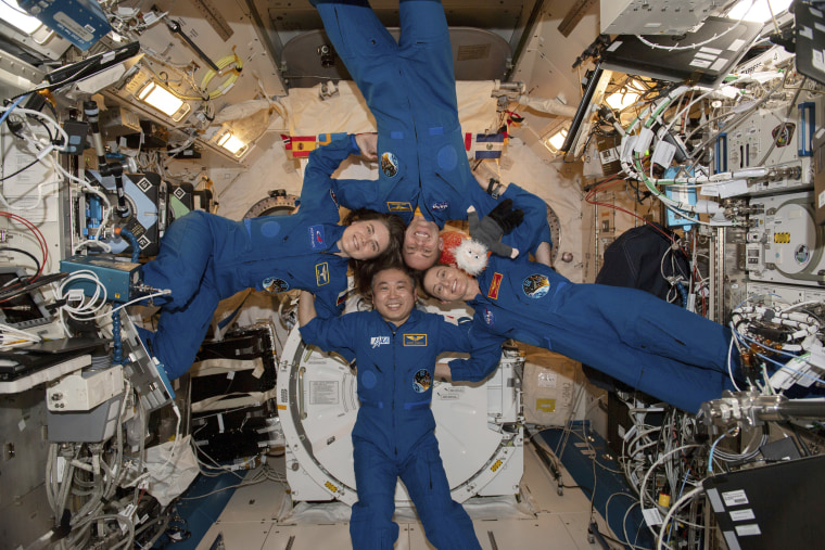 Clockwise from left, Expedition 68 Flight Engineers Anna Kikina of Roscosmos, Josh Cassada and Nicole Mann from NASA, and Koichi Wakata of Japan Aerospace Exploration Agency, inside the International Space Station on March 1, 2023. 