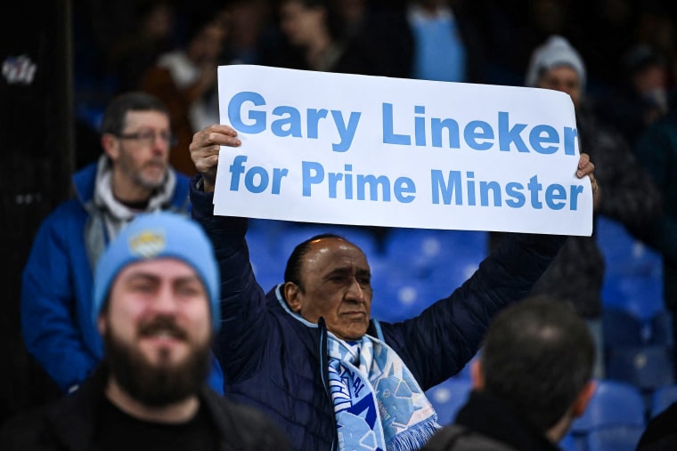 A Manchester City fan holds a banner reading "Gary Lineker for Prime Minister" before the English Premier League soccer match between Crystal Palace and Manchester City in London on March 11, 2023.