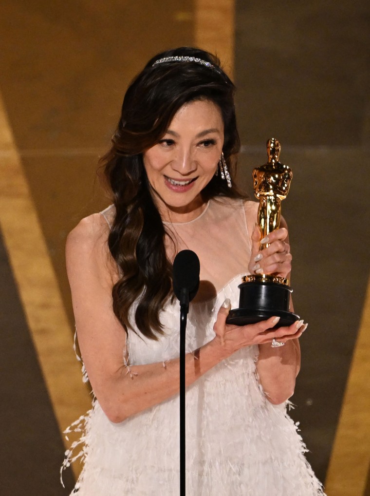 Michelle Yeoh accepts the award for best actress in a leading role during Academy Awards.