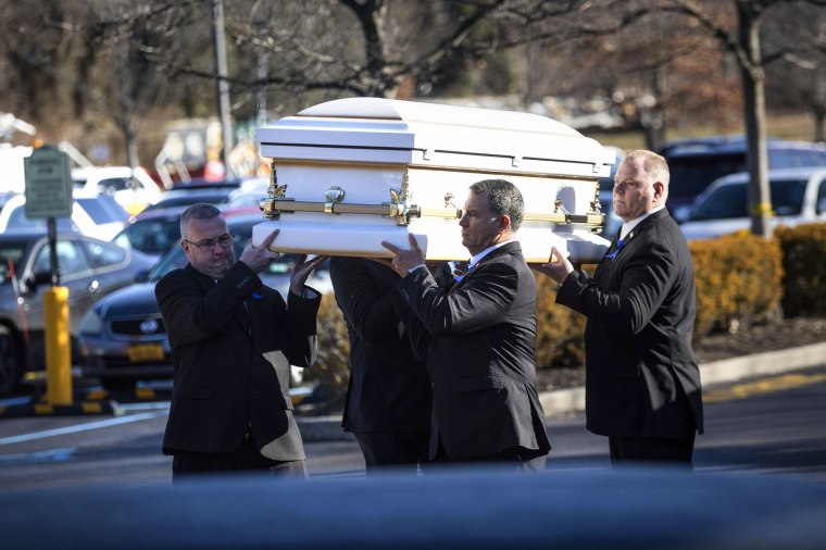 Pallbearers carry the casket into the funeral service for 8-year-old Thomas Valva in Melville, N.Y., on Jan. 30, 2020.