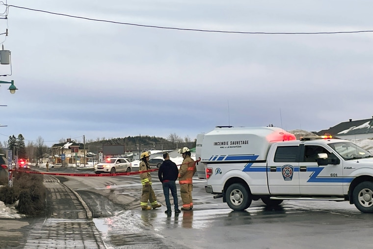 In this image provided by CTV News, first responders work the scene where two men died after a pickup truck plowed into pedestrians who were walking beside a road in Amqui, Quebec, Monday, March 13, 2023.