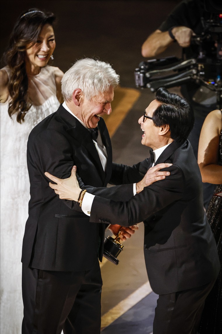 Harrison Ford and Ke Huy Quan embrace during the acceptance for the award for Best Picture for "Everything Everywhere All at Once" onstage during the 95th Annual Academy Awards on March 12, 2023 in Los Angeles.