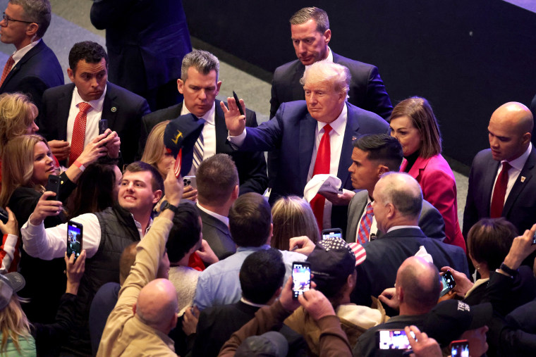 Former President Donald Trump greets guests following an event at the Adler Theatre on March 13, 2023 in Davenport, Iowa. Trump's visit follows those by potential challengers for the GOP presidential nomination, Florida Gov. Ron DeSantis and former U.N. Ambassador Nikki Haley, who hosted events in the state last week.