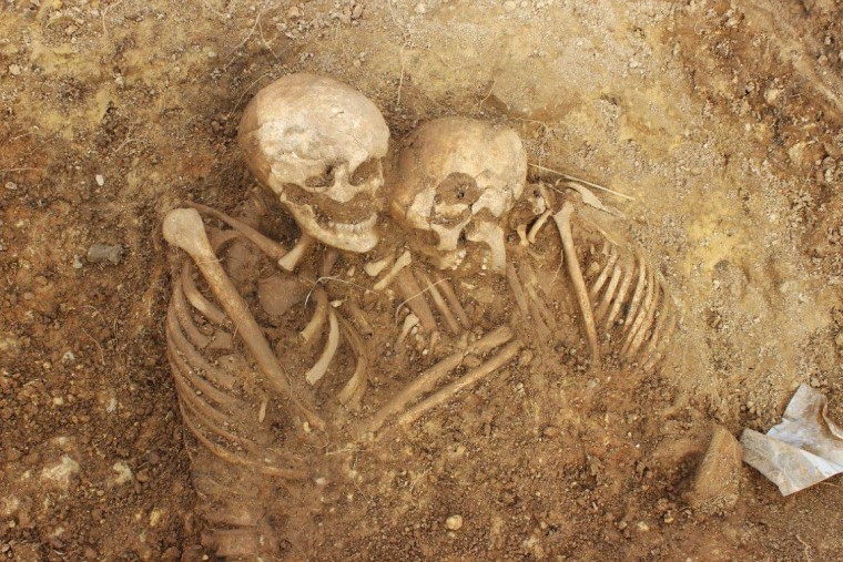 The skeletal remains of two bodies found at a burial site in Leeds, England, in spring 2022. 
