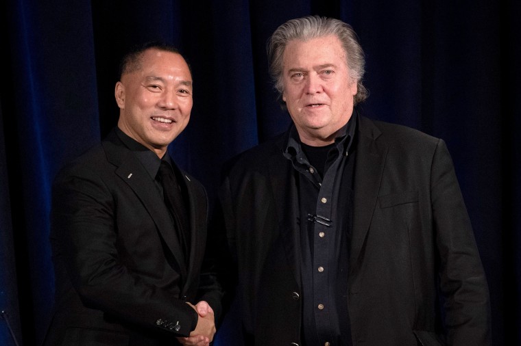 Steve Bannon greets Chinese billionaire Guo Wengui before introducing him at a news conference in New York on Nov. 20, 2018.