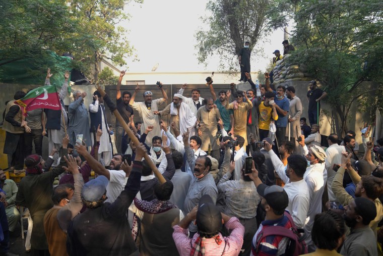 Clashes between Pakistan’s police and supporters of Khan persisted outside his home in the eastern city of Lahore on Wednesday, a day after officers went to arrest him for failing to appear in court on graft charges.