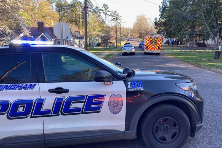Officers respond to a shooting in the East Lake district of Birmingham, Ala., on Tuesday. 