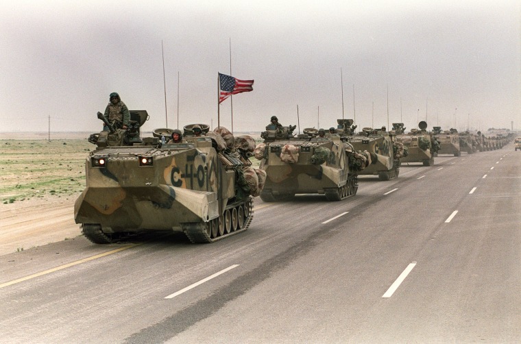 A convoy of U.S. Army tanks driving down the road from Kuwait towards Dhahran in the Saudi desert as U.S. troops begin their withdrawal from Kuwait on March 5, 1991.