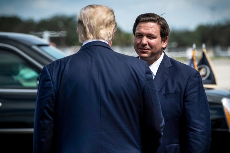 President Donald Trump is greeted by Florida Governor Ron DeSantis at Southwest Florida International Airport Oct. 16, 2020, in Fort Myers, Fla.